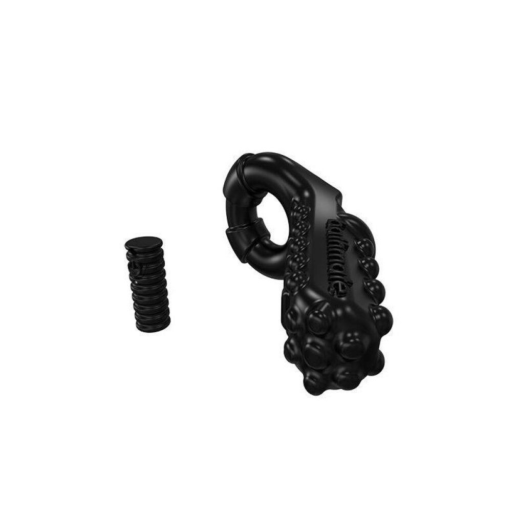 Schwarzes Wellness-Produkt mit Noppen und Ring. Ein separates, geriffeltes Element liegt daneben.