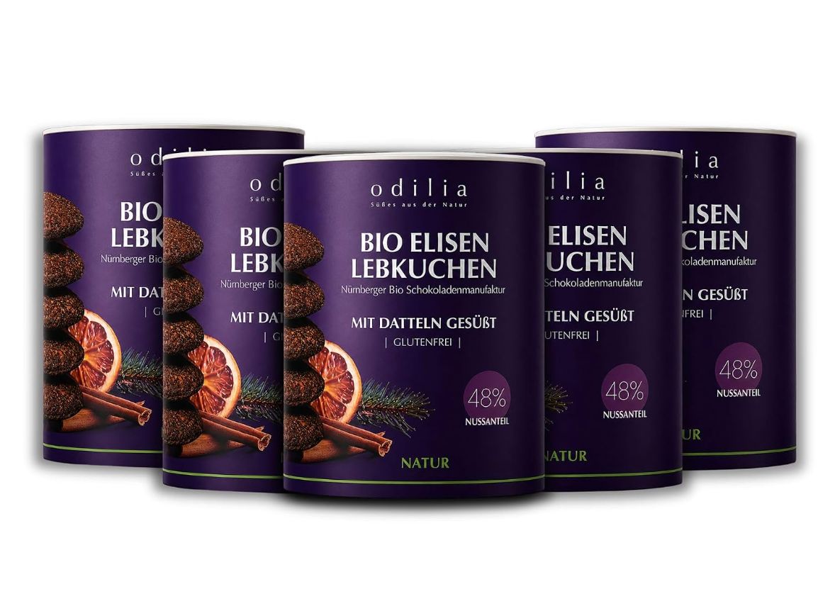 Fünf Dosen Odilia Bio Elisen Lebkuchen mit Schokolade überzogen.