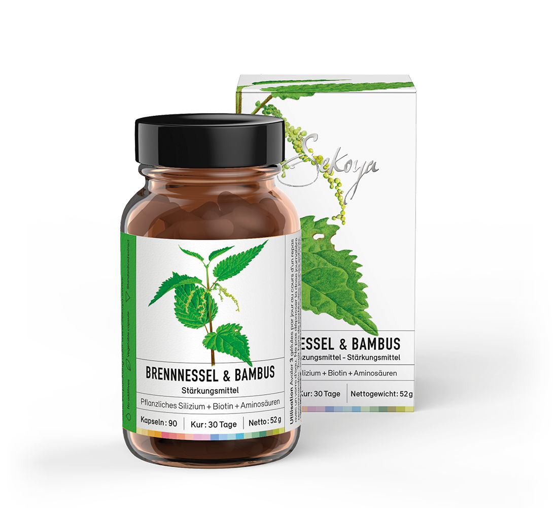 Braune Glasflasche mit schwarzem Deckel und Etikett. Daneben eine weiße Schachtel mit Produktinformationen und Logo.