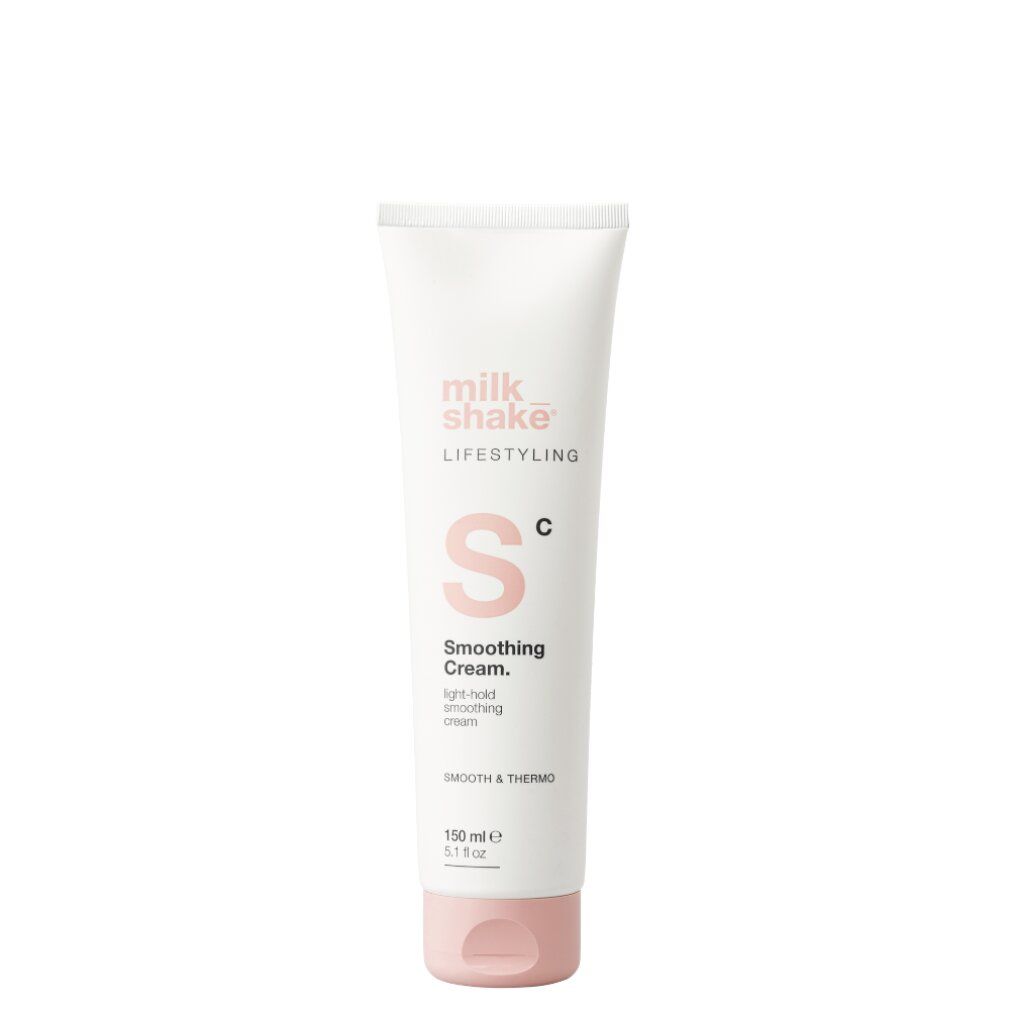 Weiße Tube mit rosa Akzenten. Aufschrift: Milk Shake, Lifestyling, Smoothing Cream. Volumen: 150 ml.