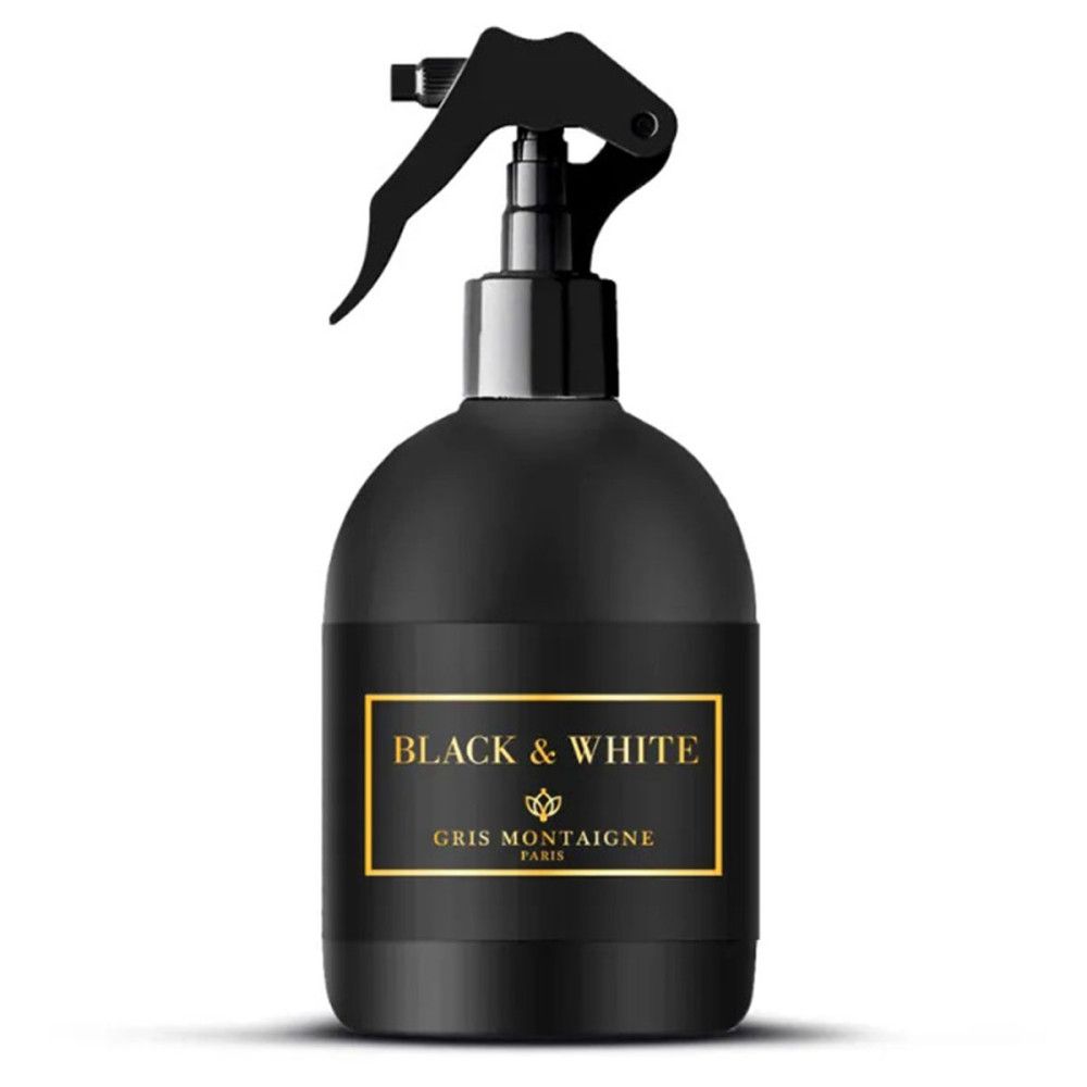 Schwarze Sprühflasche mit schwarzem Sprühkopf. Auf dem Etikett steht "Black & White" und "Gris Montaigne Paris".