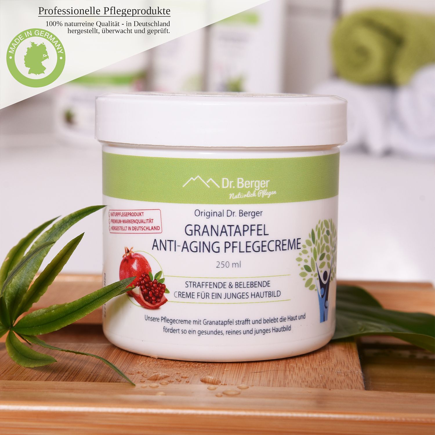 Weißer Tiegel mit grüner Banderole. Aufschrift: Original Dr. Berger Granatapfel Anti-Aging Pflegecreme. Made in Germany.