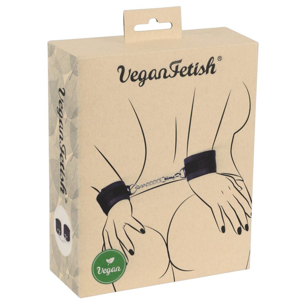 Verpackung mit Handfesseln. Aufdruck: VeganFetish. Abbildung einer Person mit Handfesseln. Vegan-Siegel.