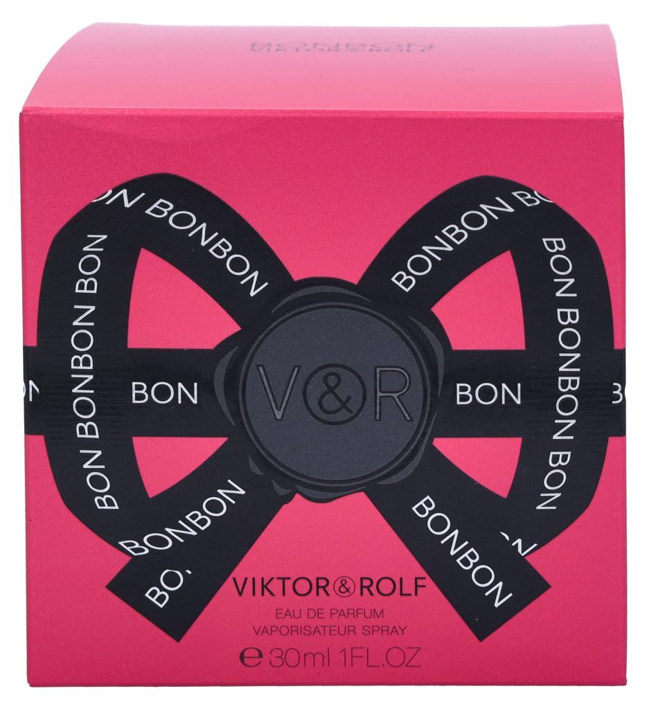 Rosa Schachtel mit schwarzer Schleife und Schriftzug BONBON. Viktor & Rolf Logo.
