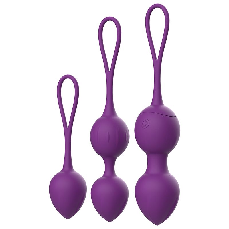 Drei lila Vibro-Bälle mit Schlaufen. Ein Ball hat einen Ein-/Ausschalter.