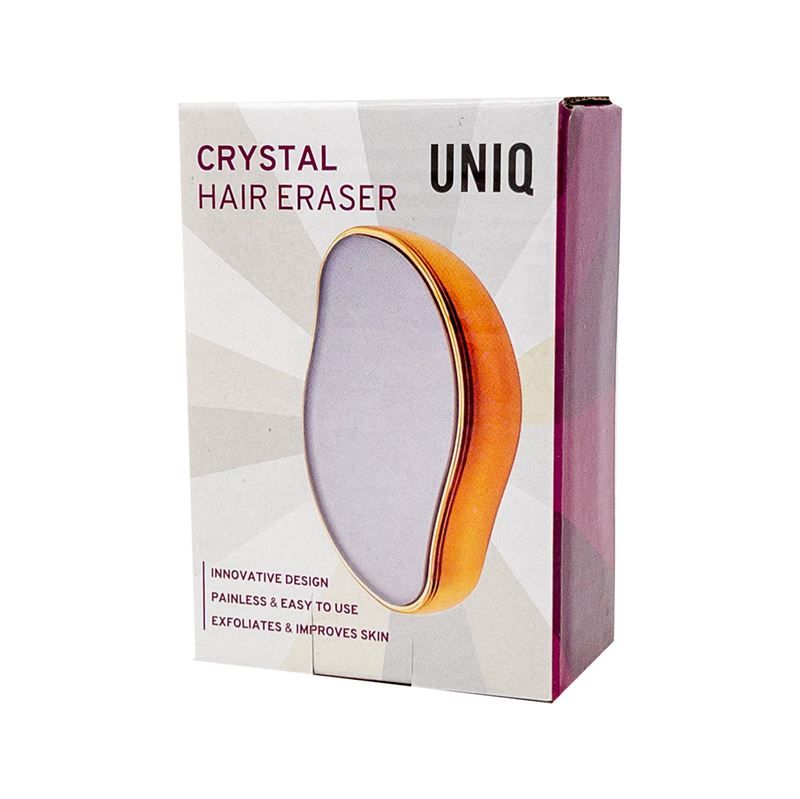Verpackung des UNIQ Crystal Hair Eraser. Aufschrift: CRYSTAL HAIR ERASER, UNIQ. Produkt in Goldfarbe.