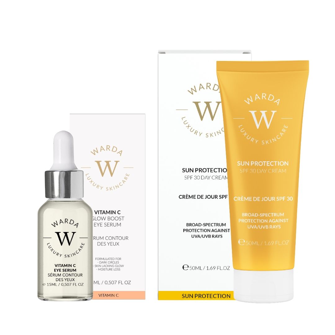 Serumflasche und Creme-Tube mit Verpackung. Aufschrift: Vitamin C, LSF 30. Marke: Warda Luxury Skincare.