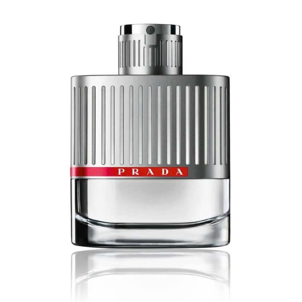Prada Luna Rossa Eau de Toilette Flakon. Silberfarbenes Gehäuse mit rotem Prada-Streifen. Transparenter Glasbehälter.
