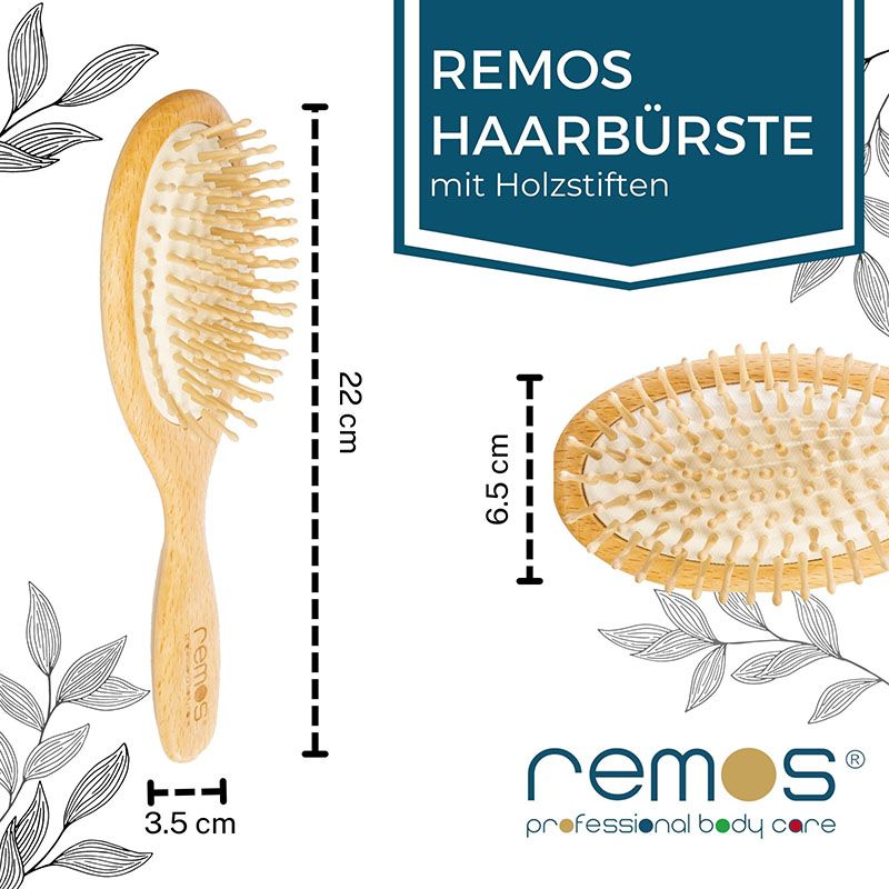 Holzbürste mit Text: REMOS HAARBÜRSTE mit Holzstiften. Maße: 22 cm lang, 6,5 cm breit, 3,5 cm dick. Logo: REMOS.