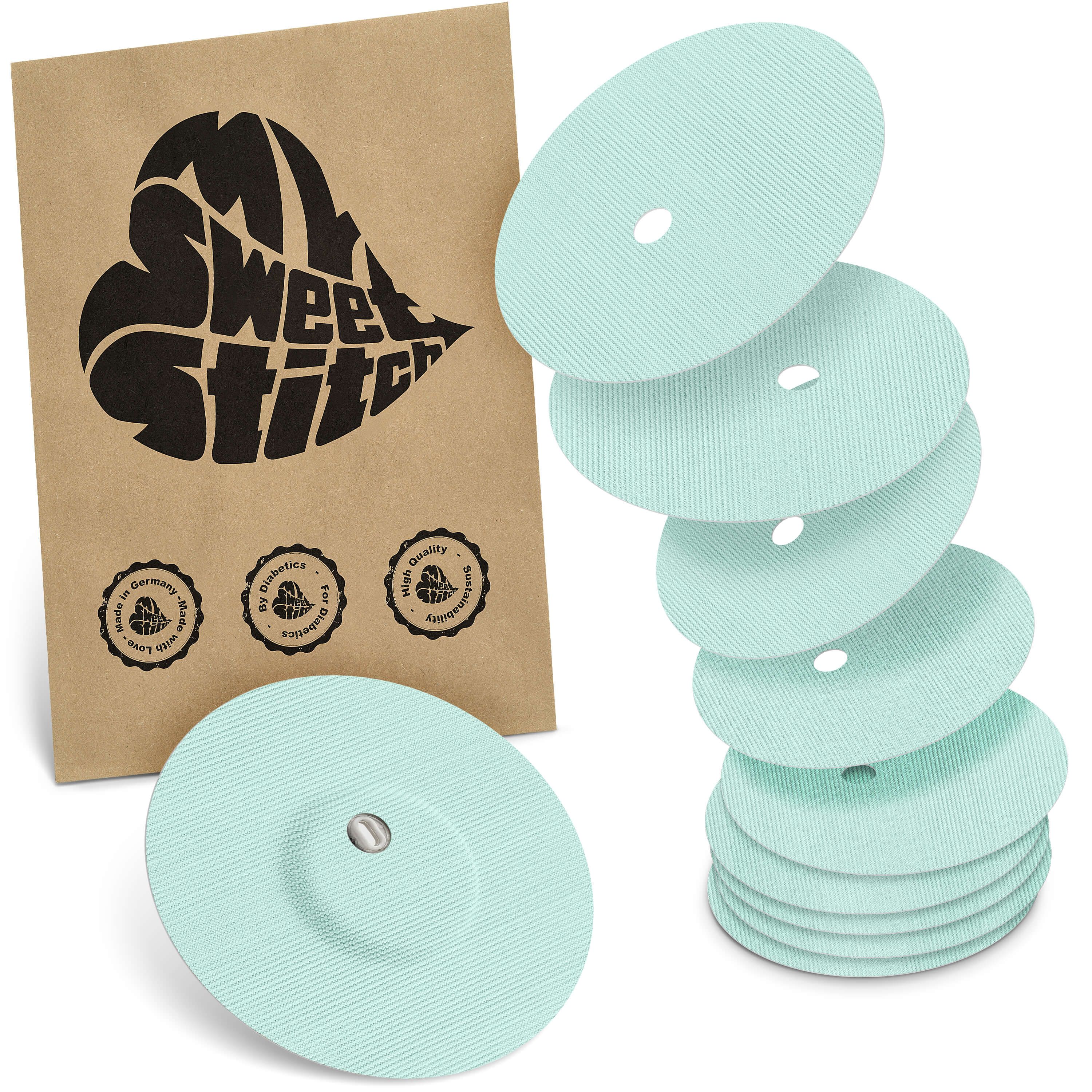 Fixierpflaster mit Belüftungsloch, hellgrün. Verpackung mit Logo MySweetStitch. Mehrere Pflaster und Verpackung.