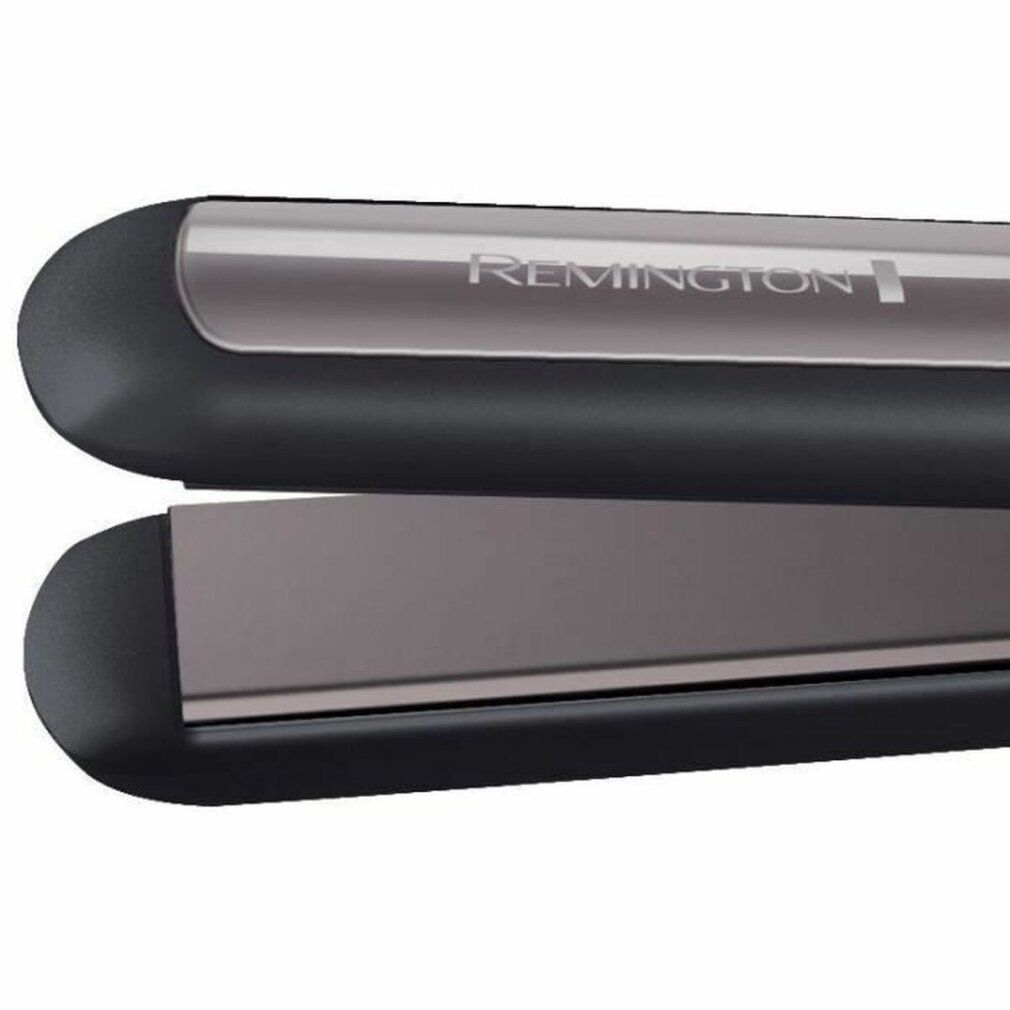 Nahaufnahme eines Haarglätters. Schwarzer Griff, graue Heizplatten. Markenschriftzug Remington.