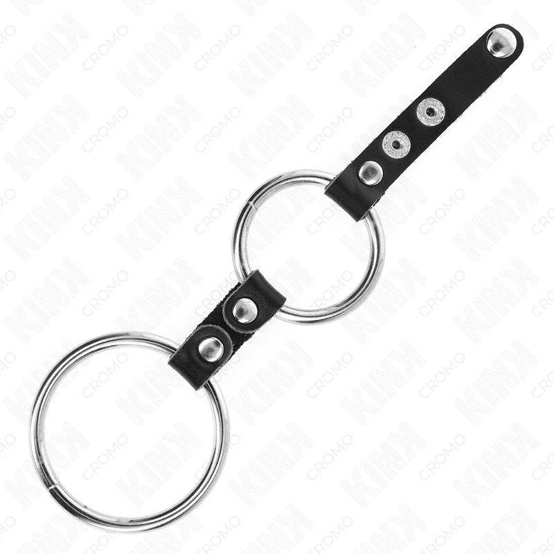 Doppelter Penisring mit zwei Metallringen, verbunden durch schwarze Lederbänder mit Druckknöpfen.