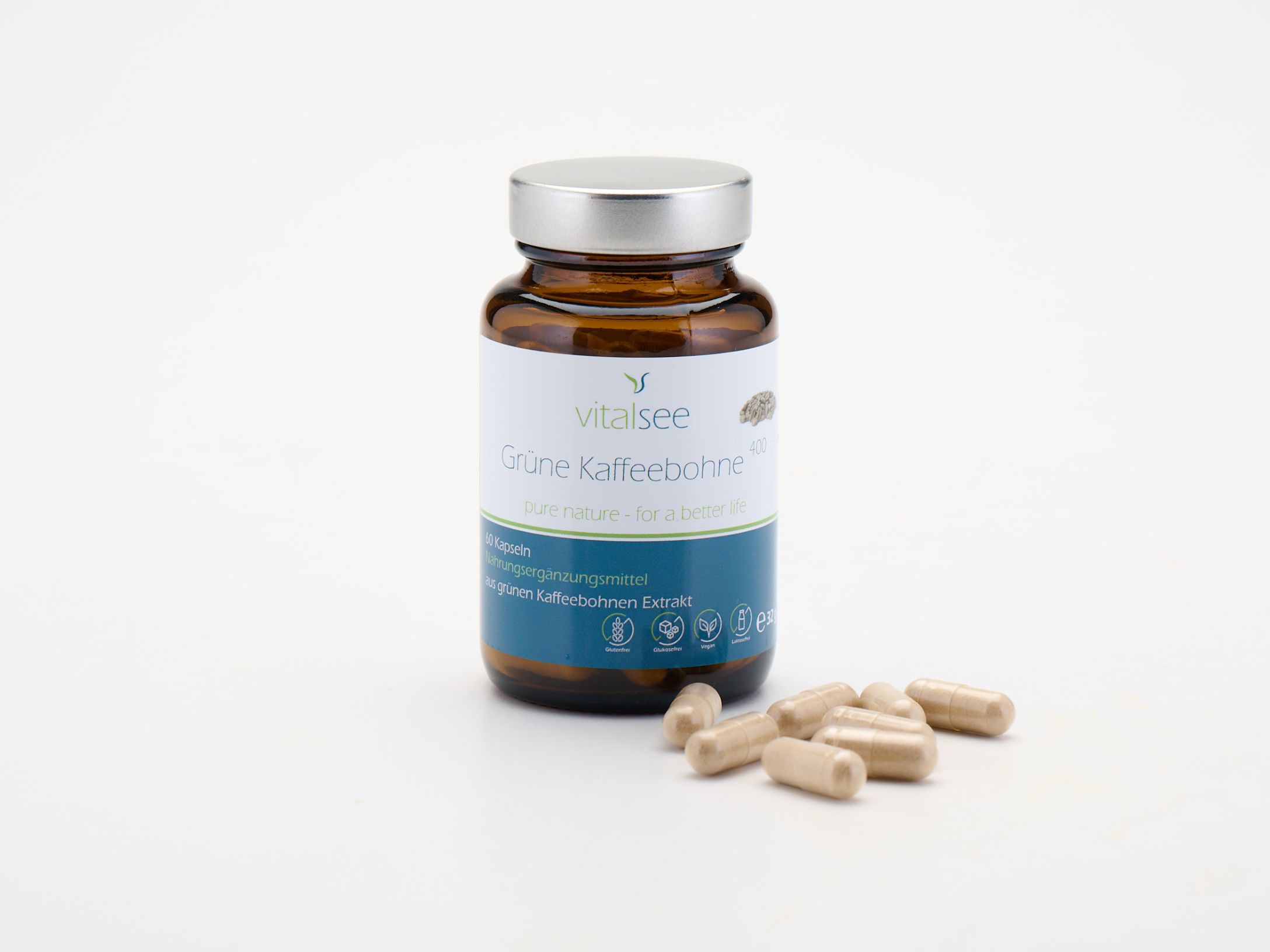 Braune Glasflasche mit silbernem Deckel und Kapseln daneben. Produktname und Logo auf dem Etikett.