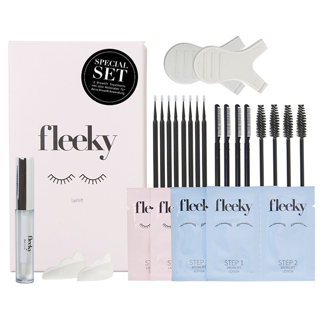 Set mit fleeky Lashlift & Browlift Kit. Enthält Verpackung, Applikatoren, Bürsten, Pads und Lotionen. Rosa und weiße Farbtöne.