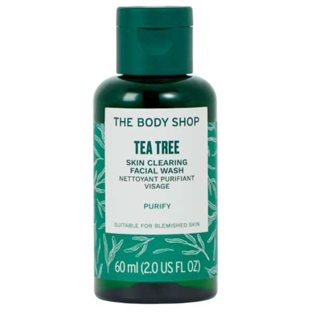 Grüne Flasche mit Klappdeckel. Aufschrift: The Body Shop, Tea Tree, Skin Clearing Facial Wash, 60 ml. Geeignet für unreine Haut.