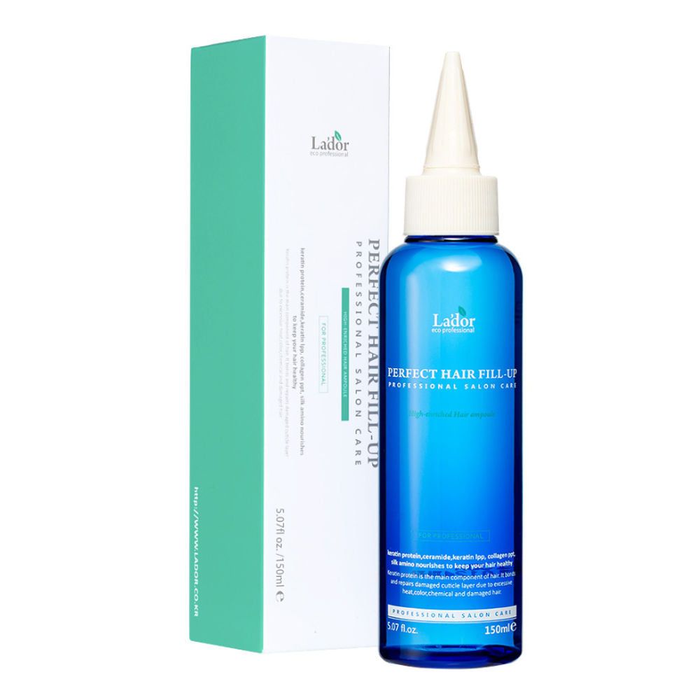 Blaue Flasche mit weißem Applikator und Karton. Aufschrift: PERFECT HAIR FILL-UP, Lador. Professionelle Haarpflege.