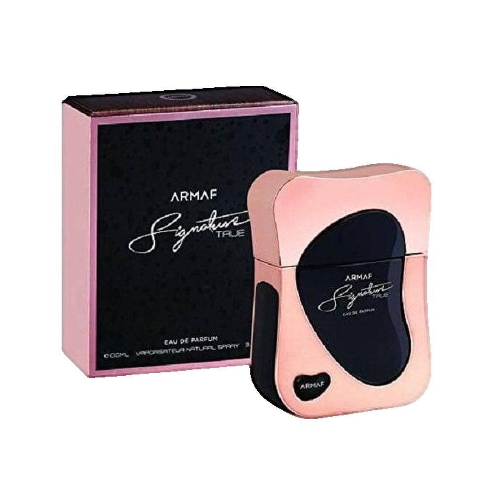 Parfumflakon und Verpackung. Rosa-goldfarbener Flakon mit schwarzem Einsatz. Schwarze Verpackung mit rosa Rahmen und Schriftzug.