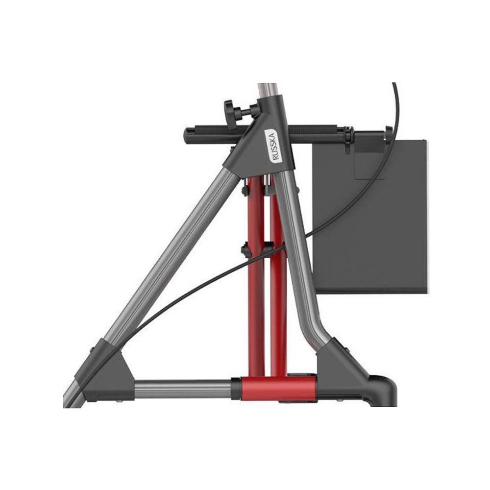 Seitenansicht eines Rollators. Roter und grauer Rahmen. Schwarzer Korb. Marke "Russka" sichtbar.