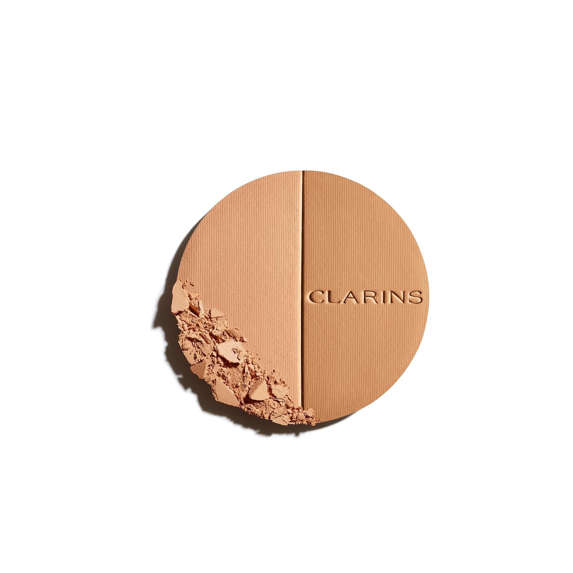 EVER BRONZE duo poudre bronzante 01. Runde, zweifarbige Puder-Kompakt-Make-up-Palette. Eine Seite ist heller, die andere dunkler.