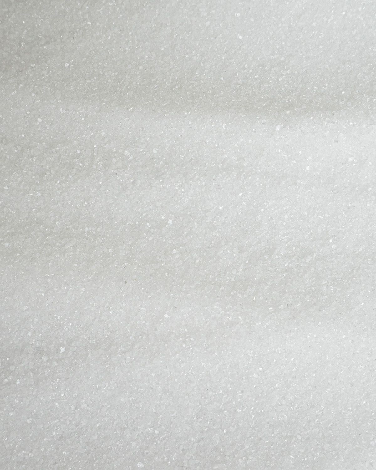 Nahaufnahme von buxtrade Saccharin Pulver, feine weiße Kristalle.