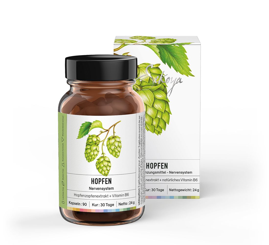 Braune Glasflasche mit schwarzen Deckel und Etikett. Daneben eine weiße Schachtel mit Hopfen-Illustration. Text: Hopfen, Nervensystem.