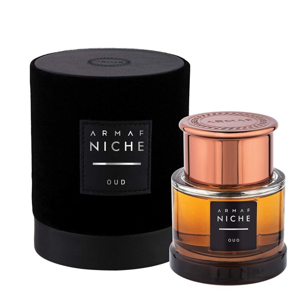 Glasflakon neben schwarzem Zylinder. Aufschrift: Armaf Niche Oud.