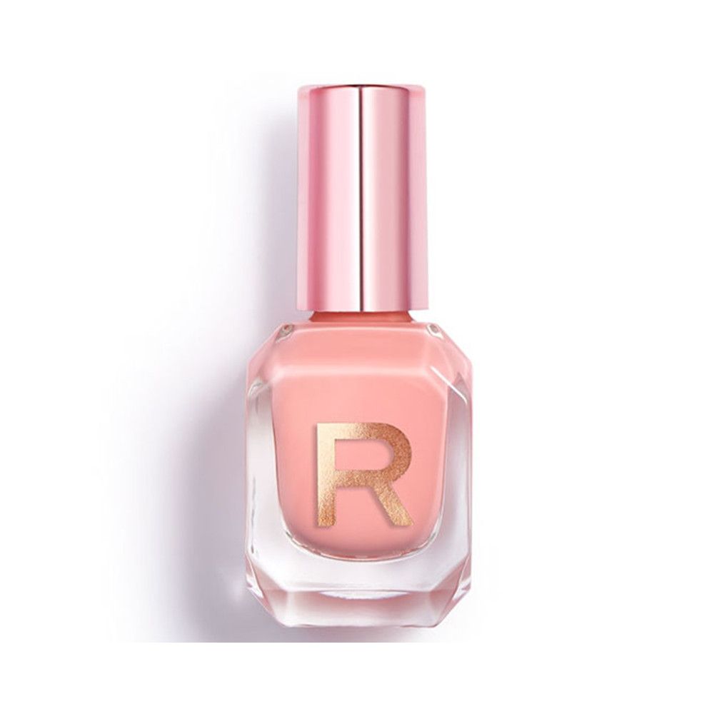 Ein hellrosa Nagellack in einem sechseckigen Glasfläschchen mit einem goldenen 'R'-Logo und einem roségoldenen Deckel.