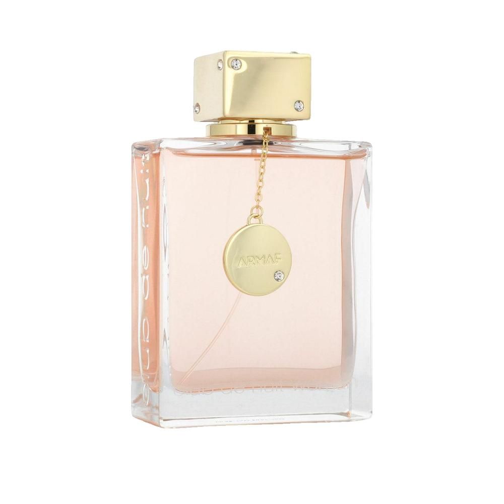 Rechteckige Parfümflasche mit goldfarbenem Verschluss. Rosa Flüssigkeit. Anhänger mit Logo und Strassstein.