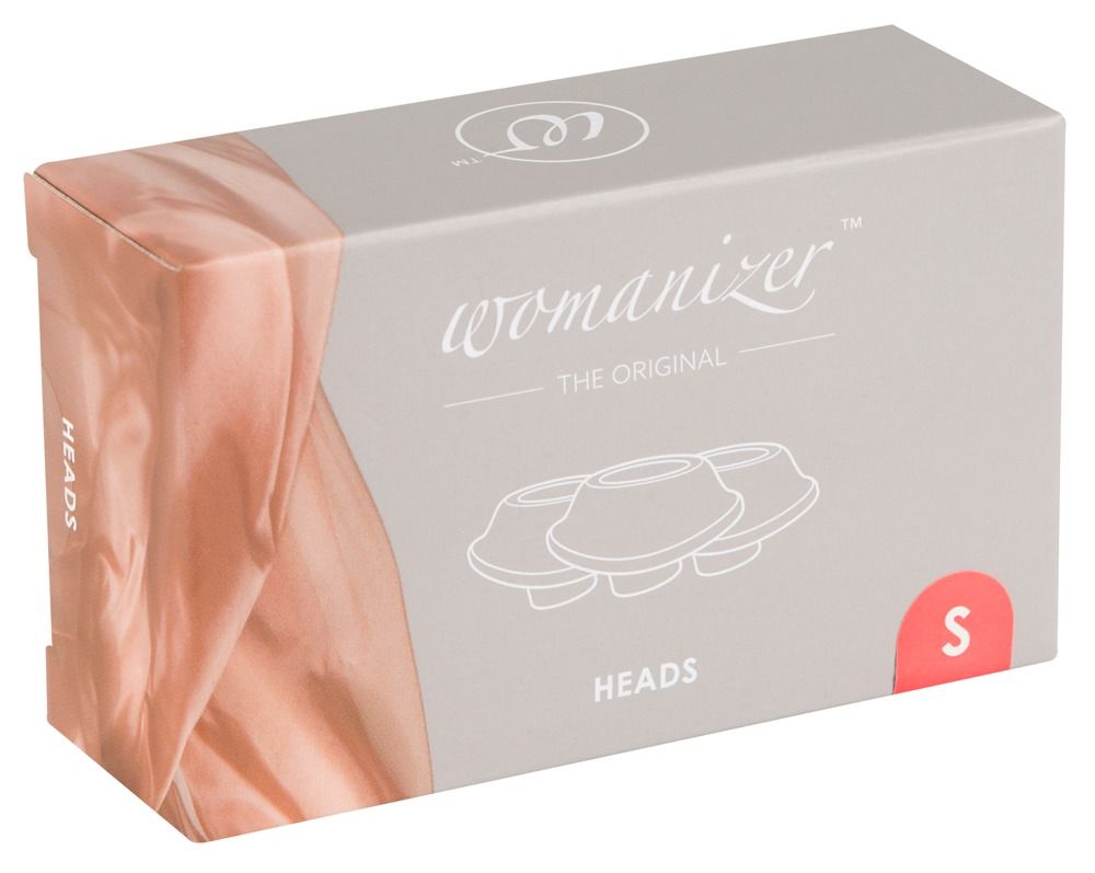 Verpackung mit Ersatzköpfen. Aufschrift: Womanizer, Heads, S. Graue Schachtel mit rosa Akzenten und Produktabbildung.