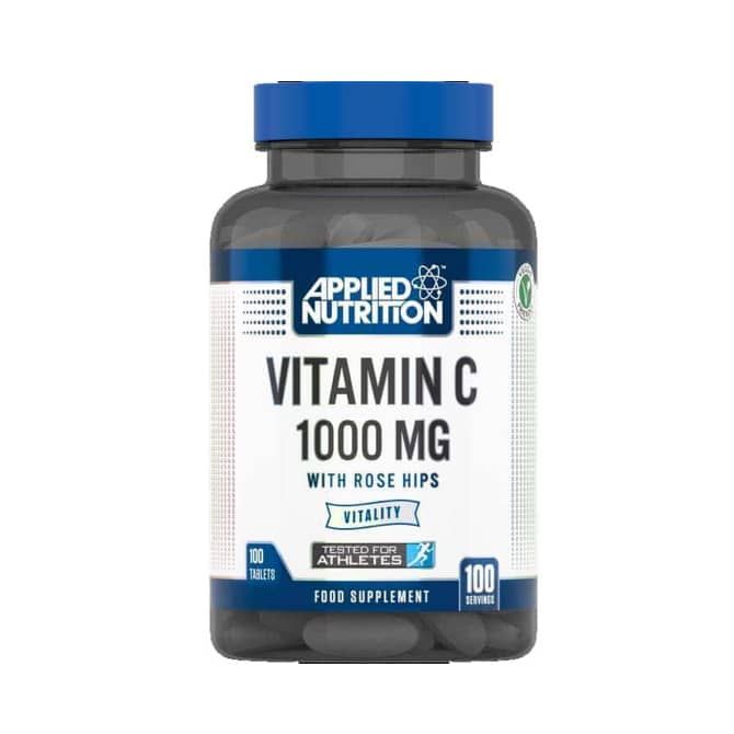 Dunkle Flasche mit blauem Deckel. Auf dem Etikett steht "Vitamin C 1000 MG" und "mit Hagebutten". Enthält 100 Tabletten.