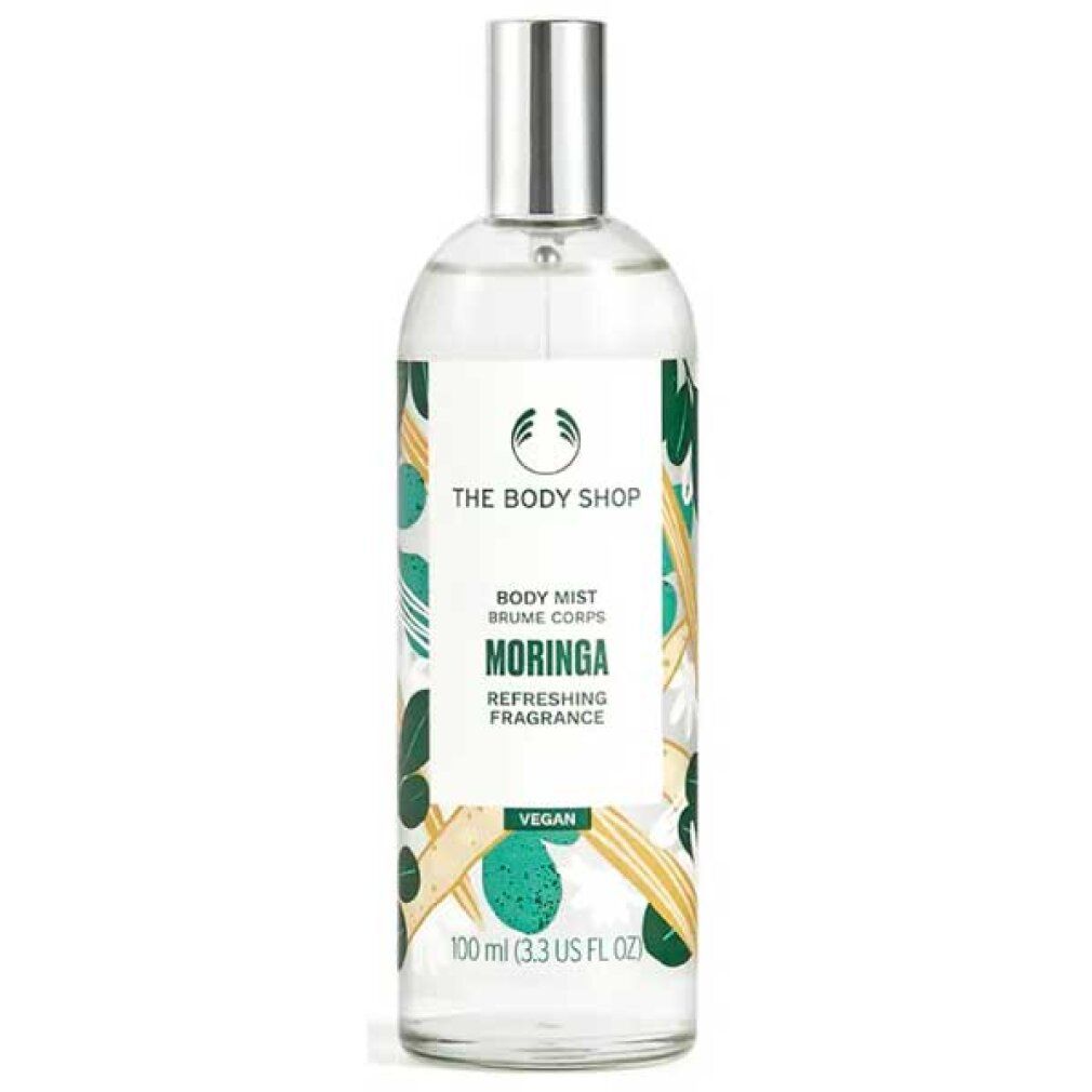 Körpernebel-Flasche mit Sprühkopf. Aufschrift: Moringa, The Body Shop. Grüne und gelbe Verzierungen.