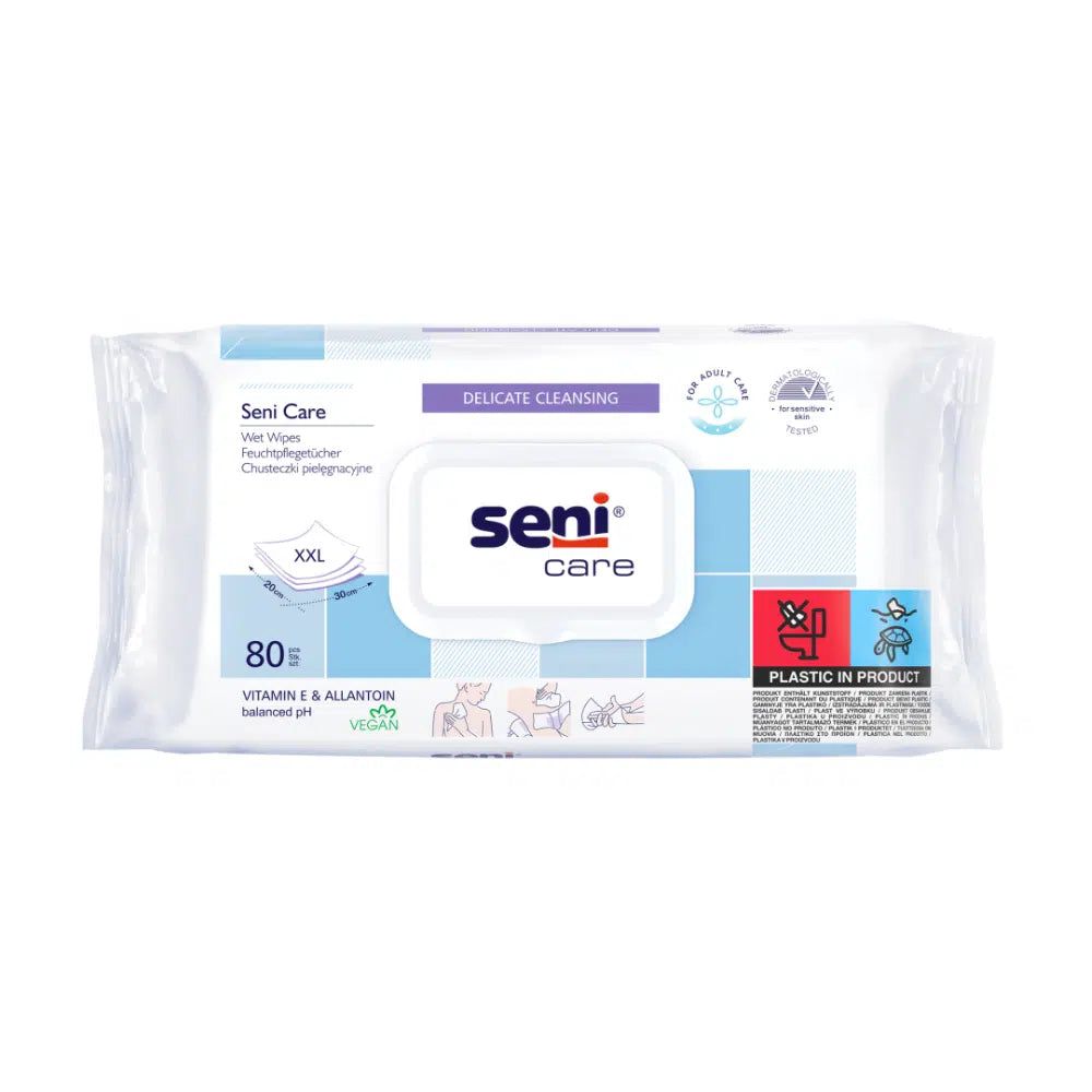 Weiße Verpackung mit Seni Care Feuchttüchern. Text: Delicate Cleansing, 80 Tücher, Vitamin E & Allantoin, vegan. Siegel.