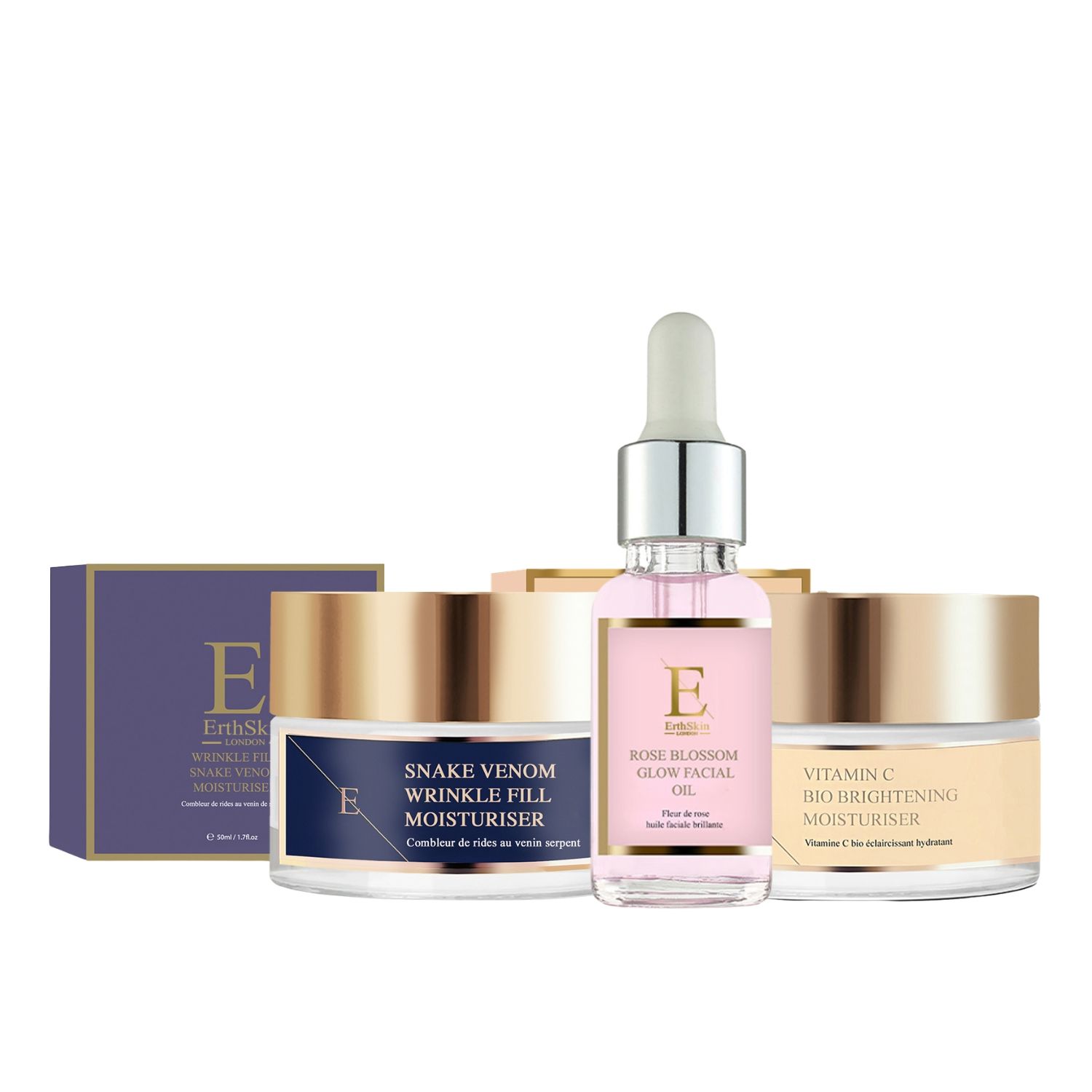 Set mit Creme- und Serum-Behältern. Goldfarbene Deckel, blaue und beige Etiketten. Markenname sichtbar.