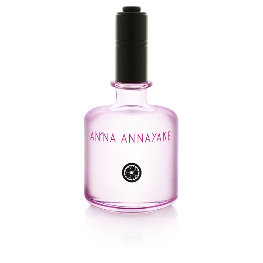 Parfümflasche mit schwarzem Verschluss. Rosa Flüssigkeit. Aufschrift: ANNA ANNAYAKE und Logo. Klarer Glasbehälter.