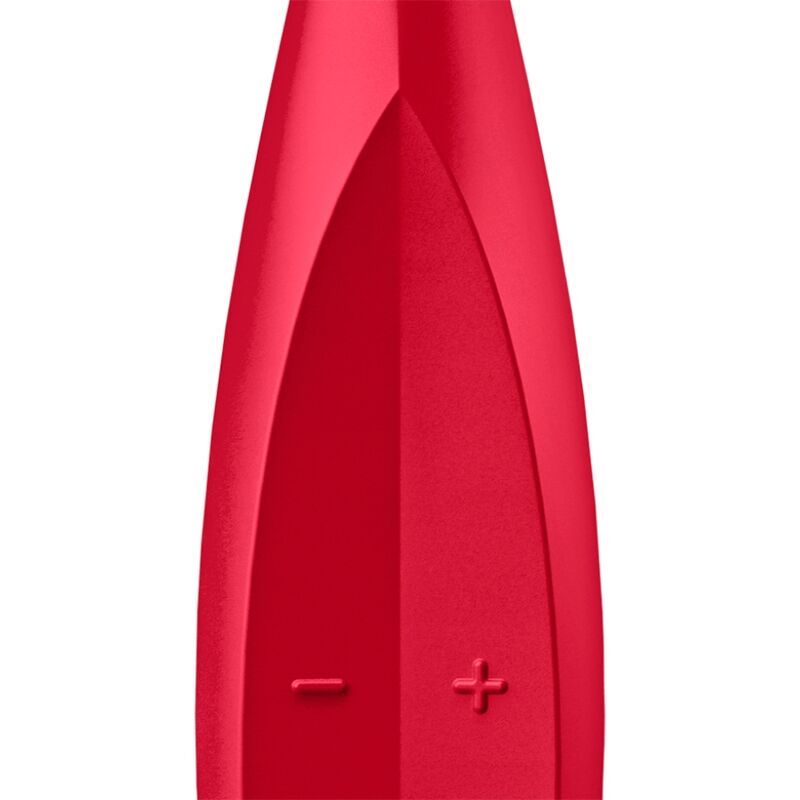 Nahaufnahme eines roten Vibrators. Sichtbare Plus- und Minuszeichen.