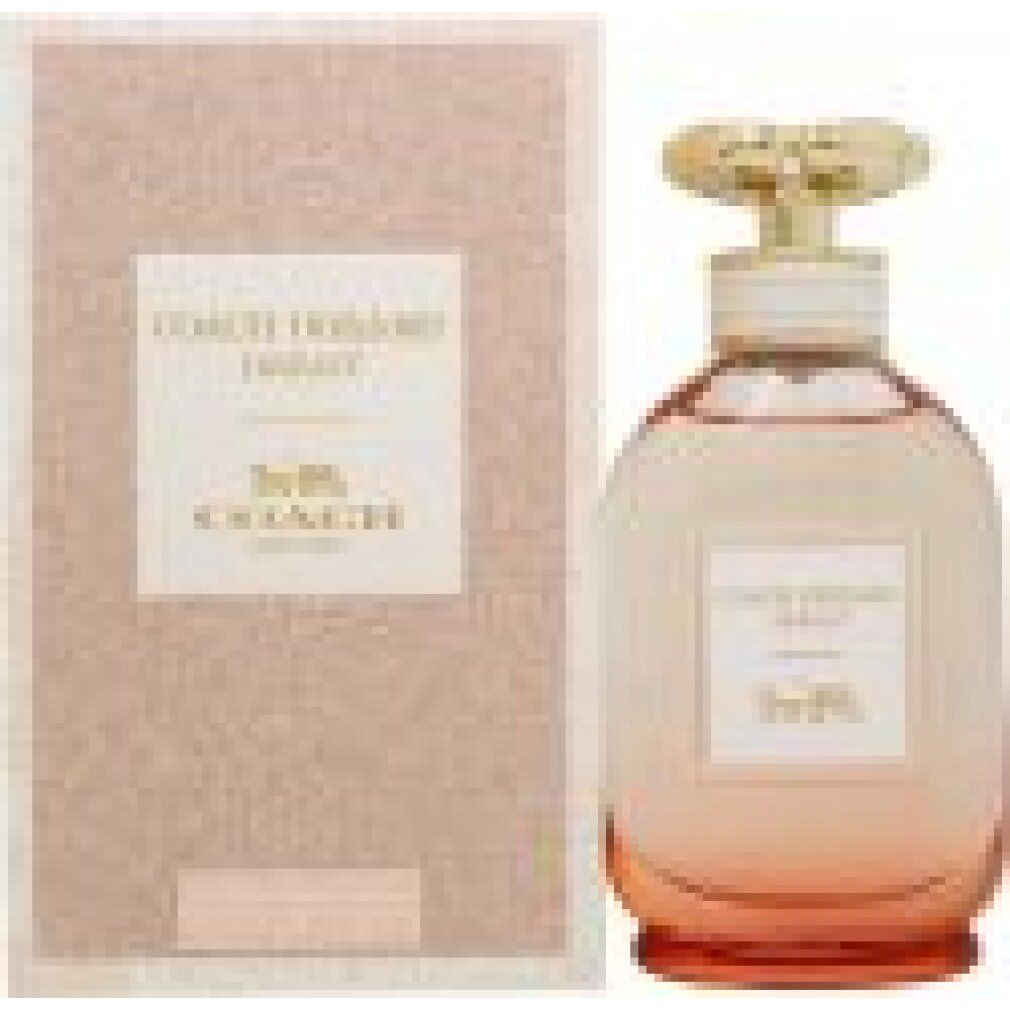 Parfümflakon und Verpackung. Text auf der Verpackung: Coach Dreams Sunset. Flakon mit Farbverlauf von rosa nach orange.