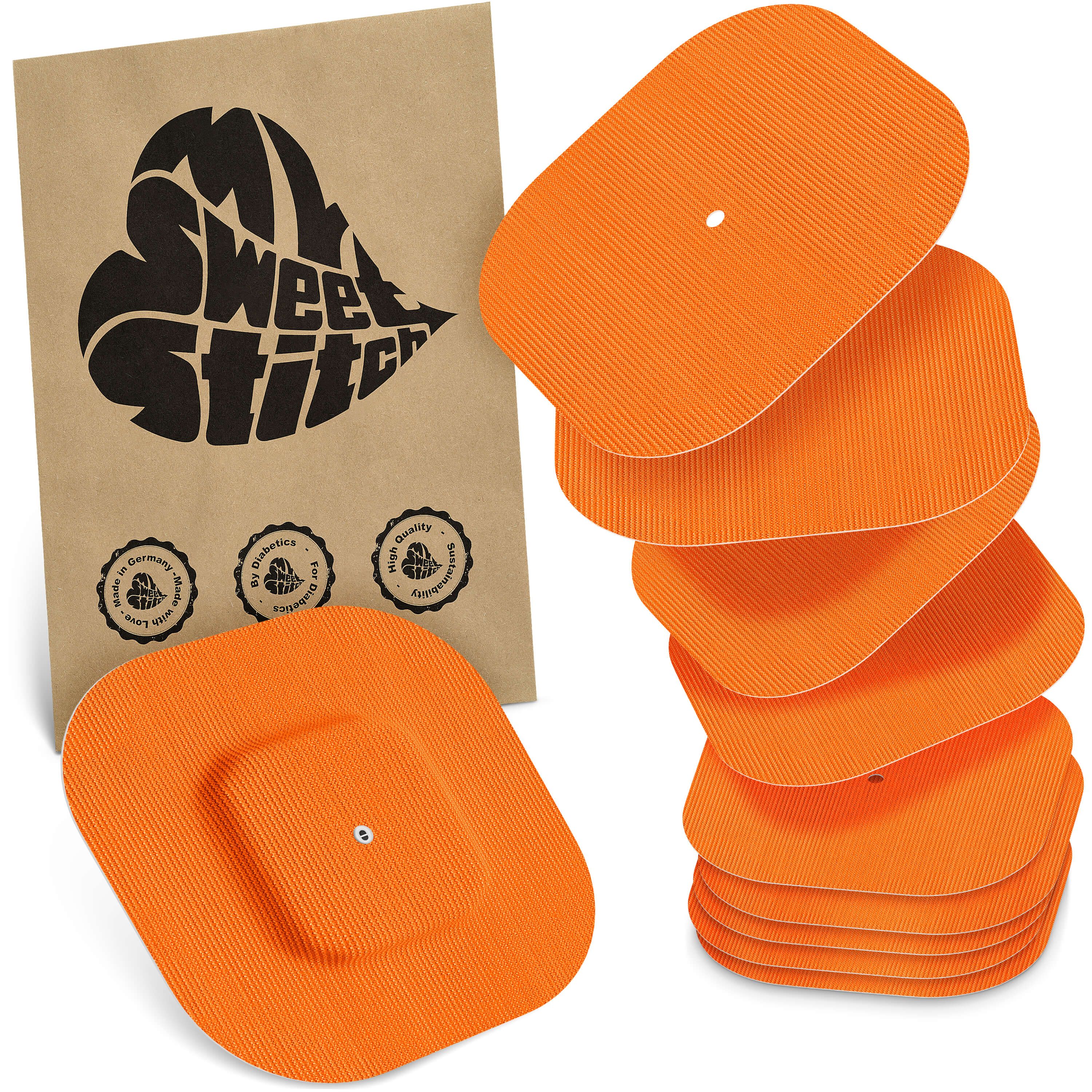 Orange, rechteckige Elektrodenpads mit gerippter Oberfläche und zentralem Anschlussloch.
