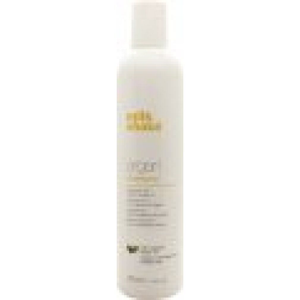 Hohe, weiße Flasche mit gelbem Aufdruck. Beschriftung: milk_shake Argan Shampoo. Enthält Arganöl. 300 ml.