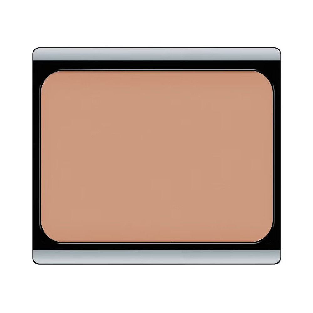 Kompakt-Make-up in einem schwarzen Behälter mit silberfarbenem Rand. Beige Creme.