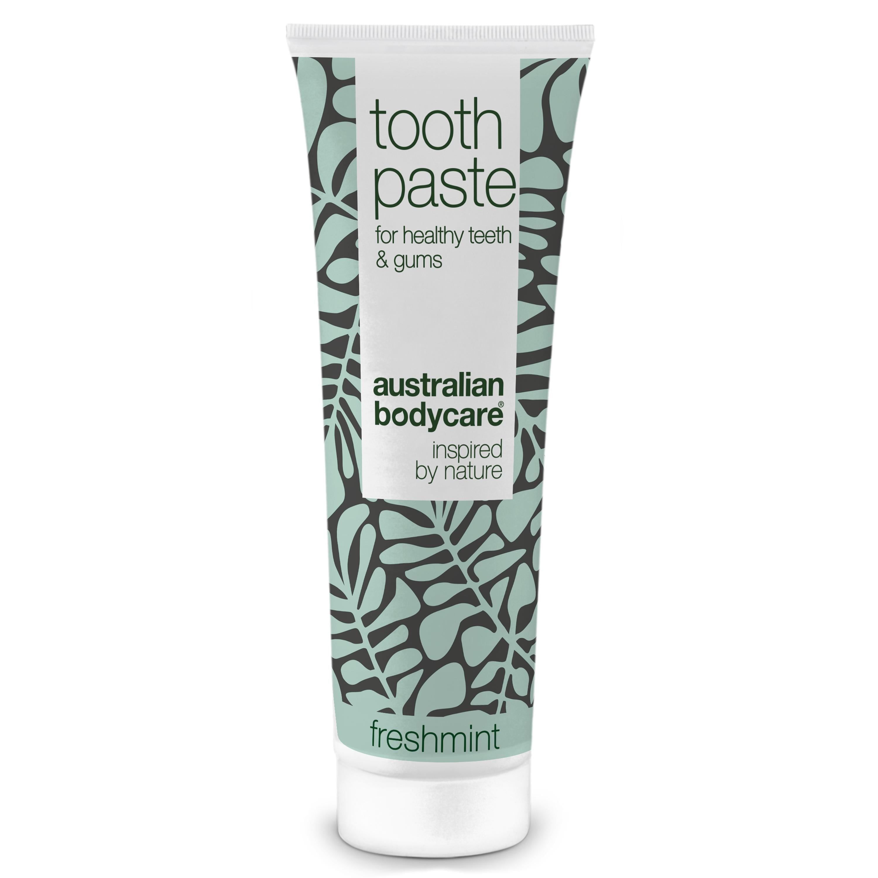Zahnpasta-Tube mit floralem Muster. Text: Toothpaste, für gesunde Zähne & Zahnfleisch, Australian Bodycare, Freshmint.