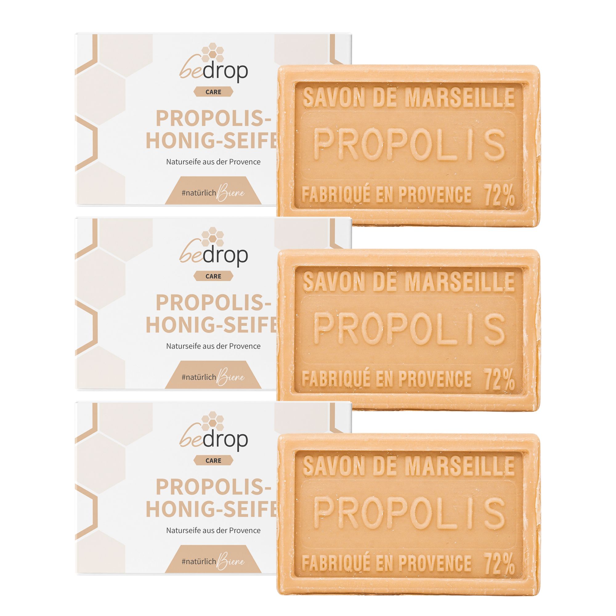 Drei Seifenstücke und Verpackungen. Seife mit Aufschrift 'SAVON DE MARSEILLE PROPOLIS'. Verpackung mit 'bedrop' und 'Propolis-Honig-Seife'.