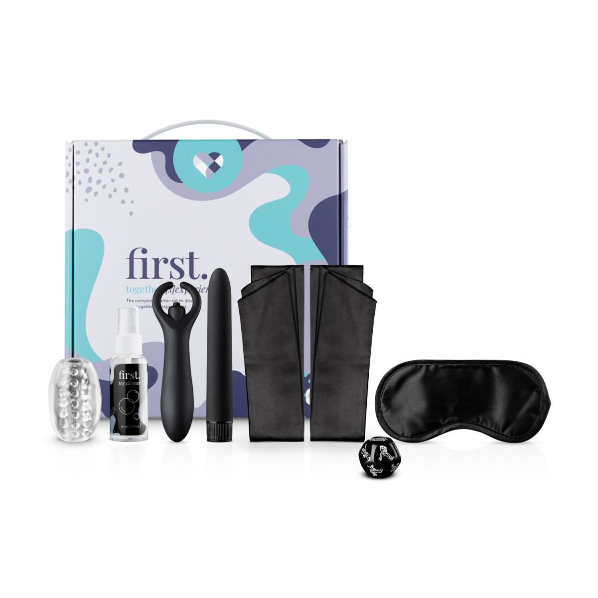 Set mit Zubehör: Vibrator, Augenmaske, Handfesseln, Würfel, Gleitgel und Reiniger. Verpackung mit Griff und Logo.