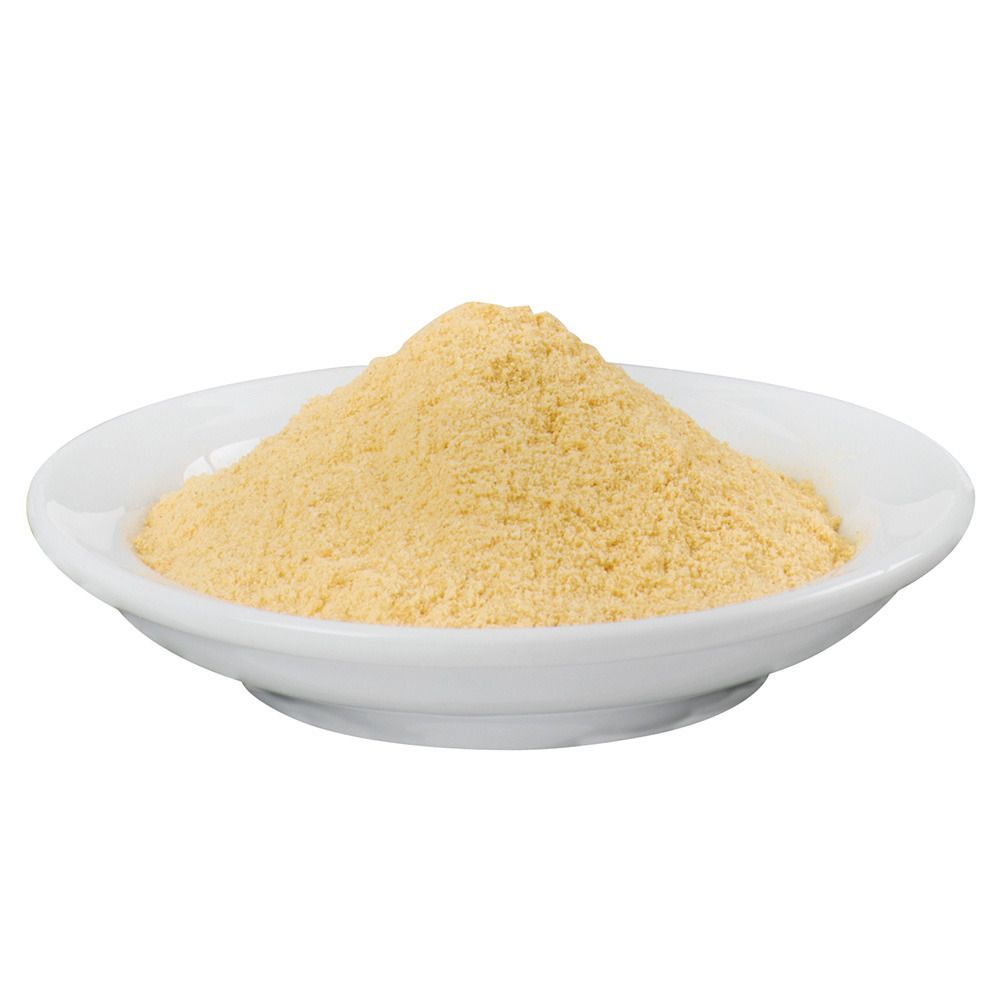 Gelbliche Pulver in weißer Schale. Runde Form, leicht erhöht. Produkt nicht erkennbar.