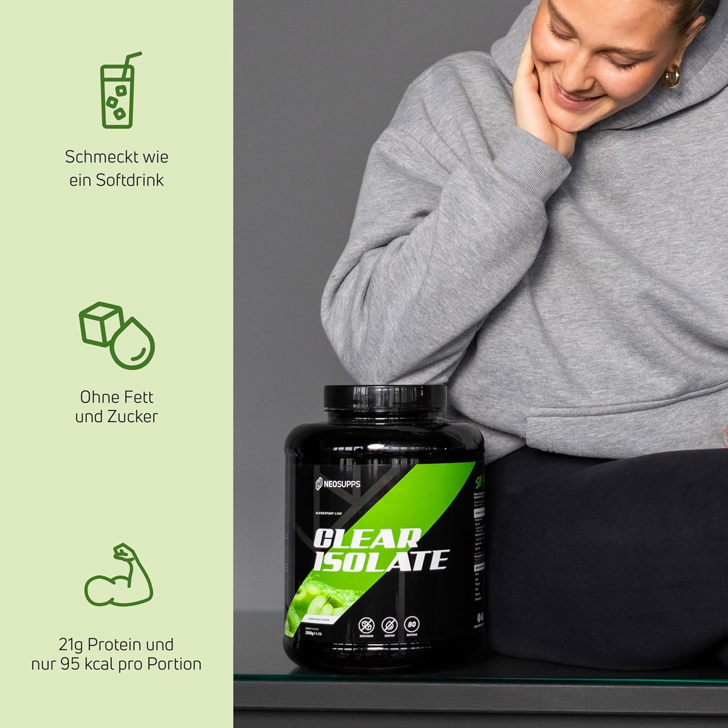 Schwarze Dose mit grünem Etikett. Text: Clear Isolate, 21g Protein, 95 kcal. Frau lächelt.
