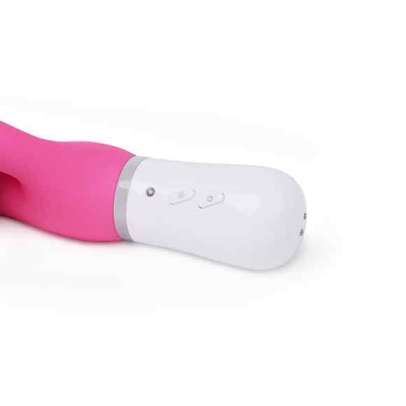 Nahaufnahme des weißen Sockels eines rosa Vibrators. Zwei Knöpfe und kleine Löcher sind sichtbar.