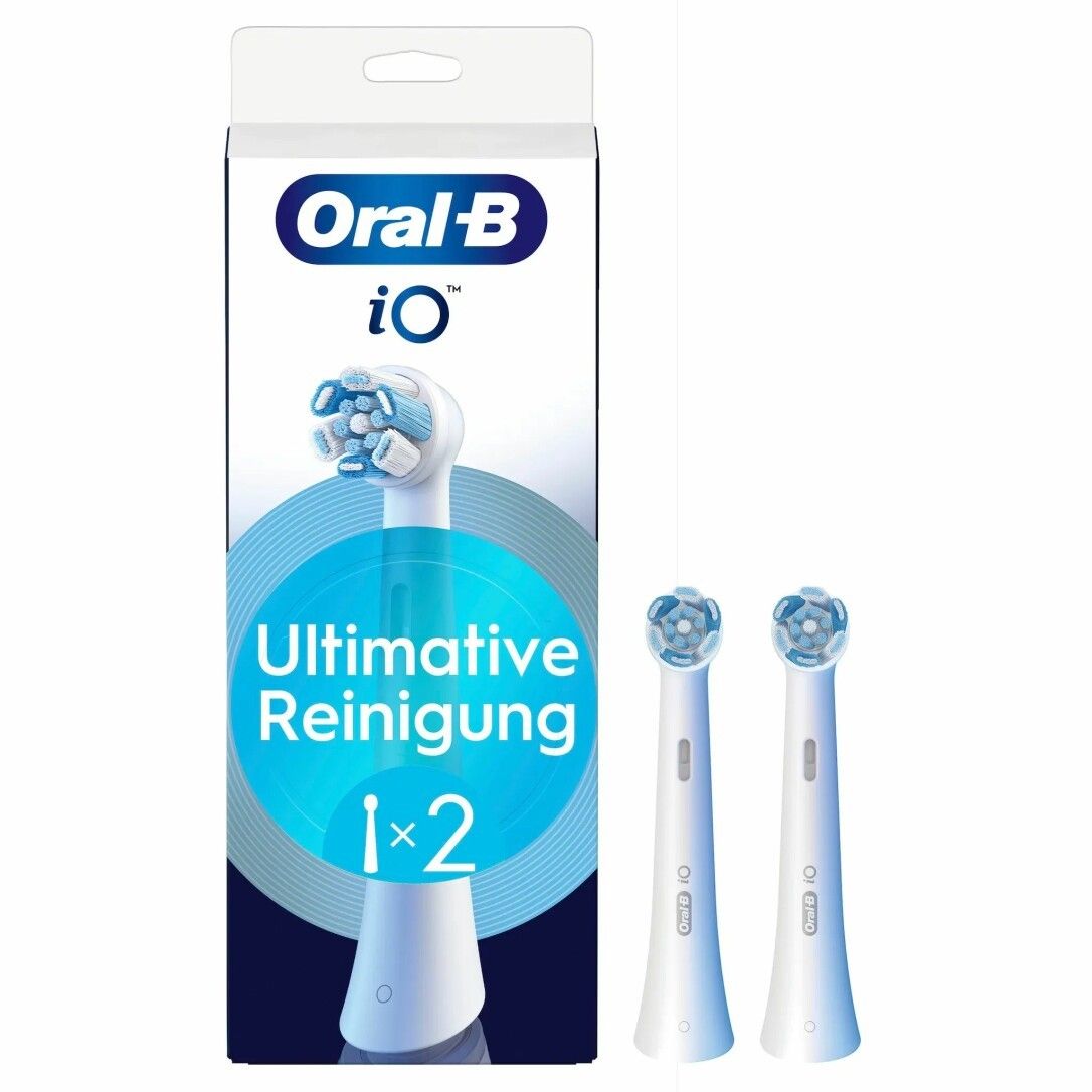 Zahnbürstenaufsätze. Verpackung mit Logo Oral-B iO und Aufschrift Ultimative Reinigung. Zwei Aufsteckbürsten daneben.