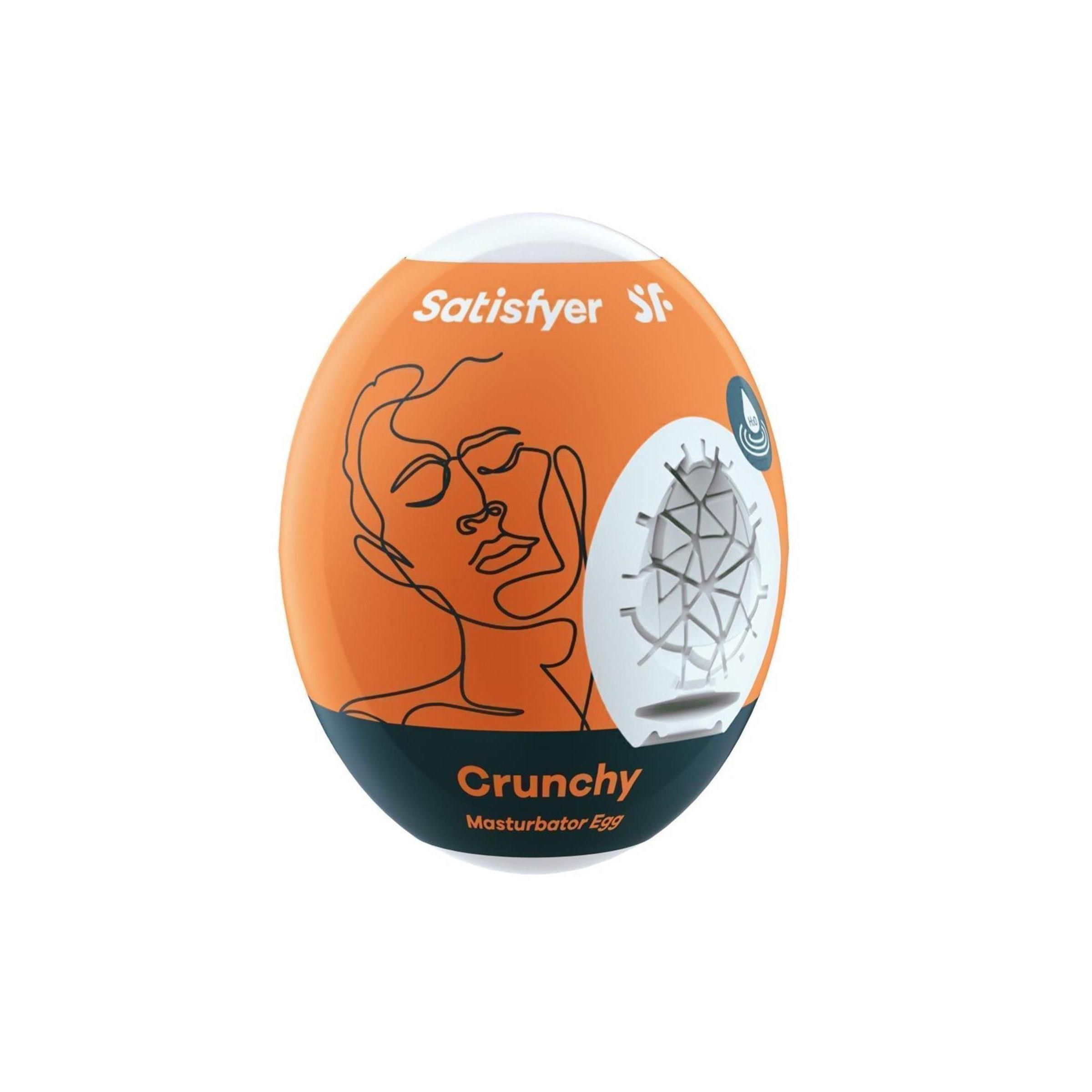 Satisfyer Masturbator Ei 'Crunchy' in Orange. Eiförmiges Design mit Gesichtskontur und gerippter Textur.
