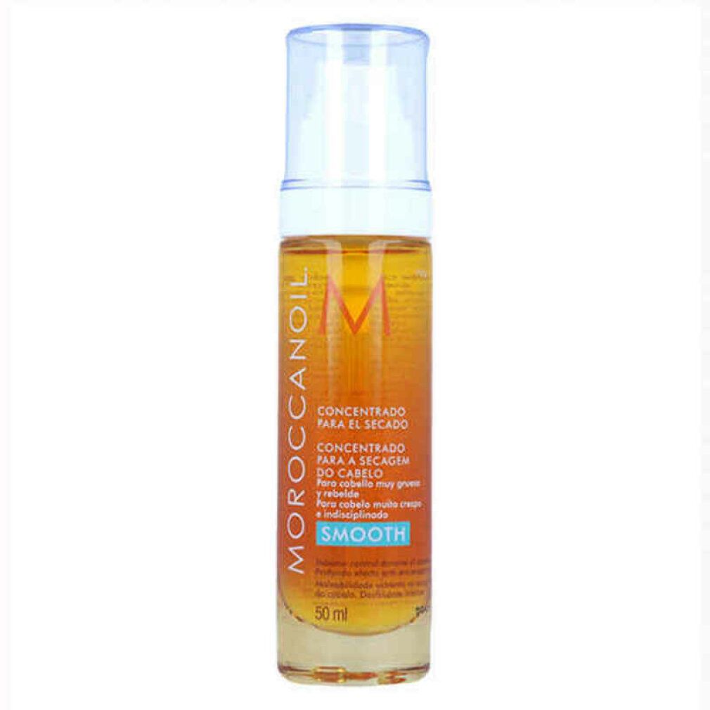 Zylindrische Flasche mit gelber Flüssigkeit und Sprühkopf. Aufschrift: Moroccanoil, Concentrado para el secado, Smooth.