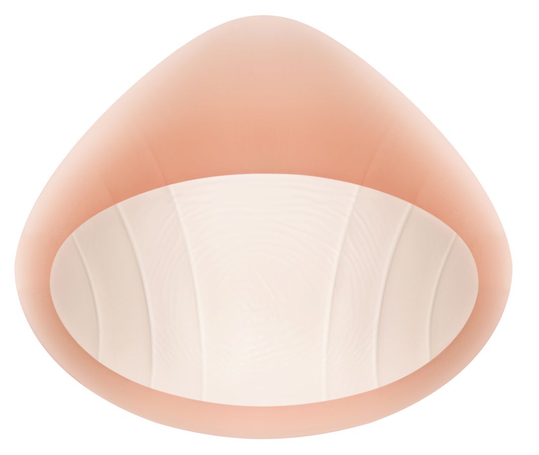 Ausgleichsepithese, Ansicht von unten. Helle, geriffelte Innenseite. Tropfenform.
