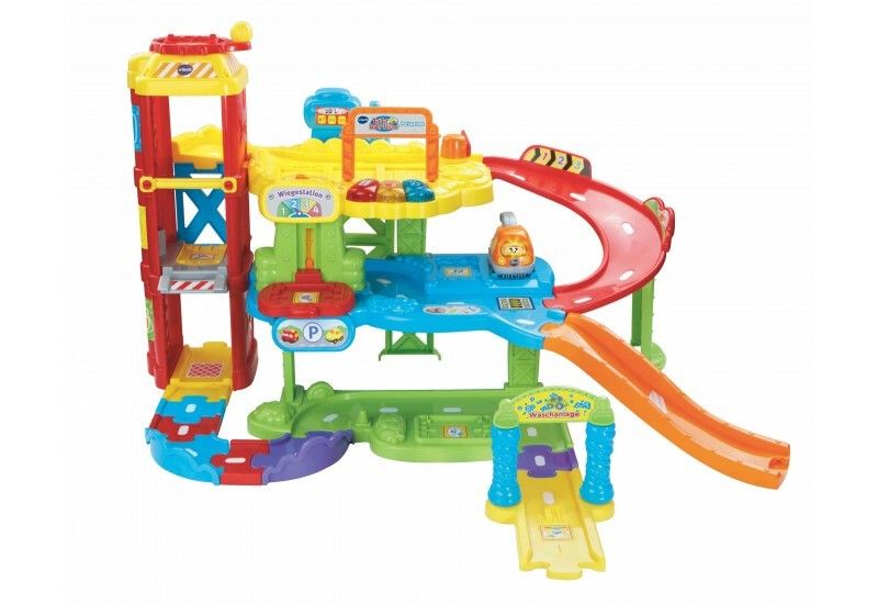Mehrfarbige Parkgarage mit Rampen, Aufzug und Rutsche. Das Spielzeug hat das VTech-Logo.